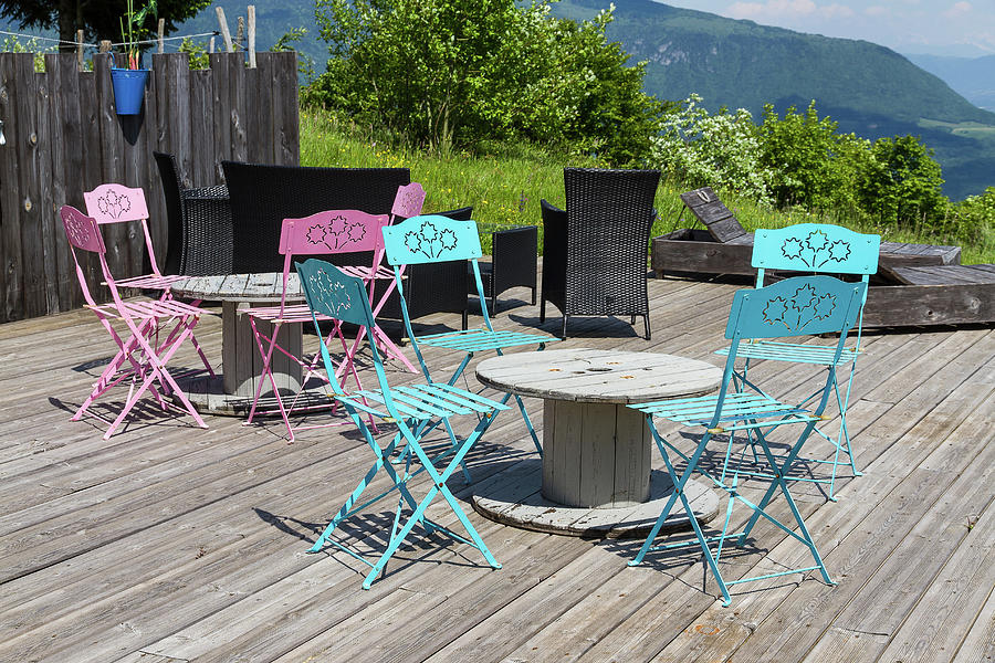 Colorful cafe chairs Photograph by Paul MAURICE