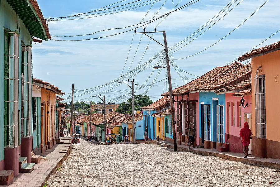 Colorful houses on a cobblestone street in Trinidad. Photograph by ...