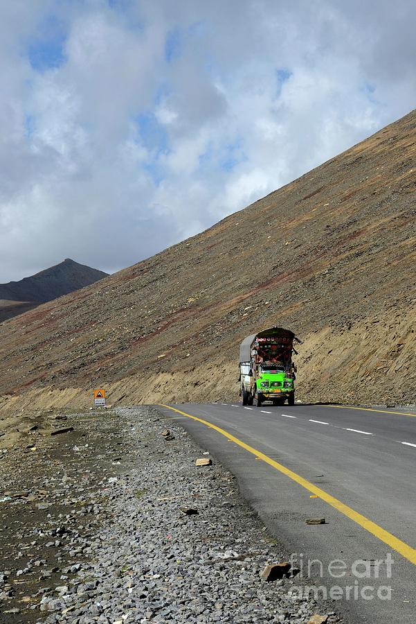 Colorful truck on Karakoram Highway amid mountains Babusar Pass Pakistan Photograph by Imran Ahmed