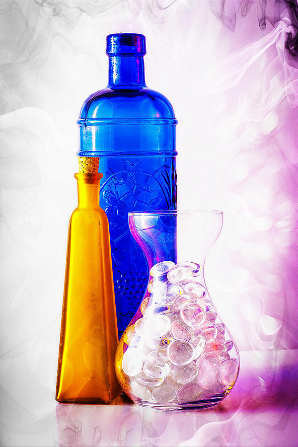 Colourful jars and bottles with glass pebbles. Photograph by John Paul Cullen