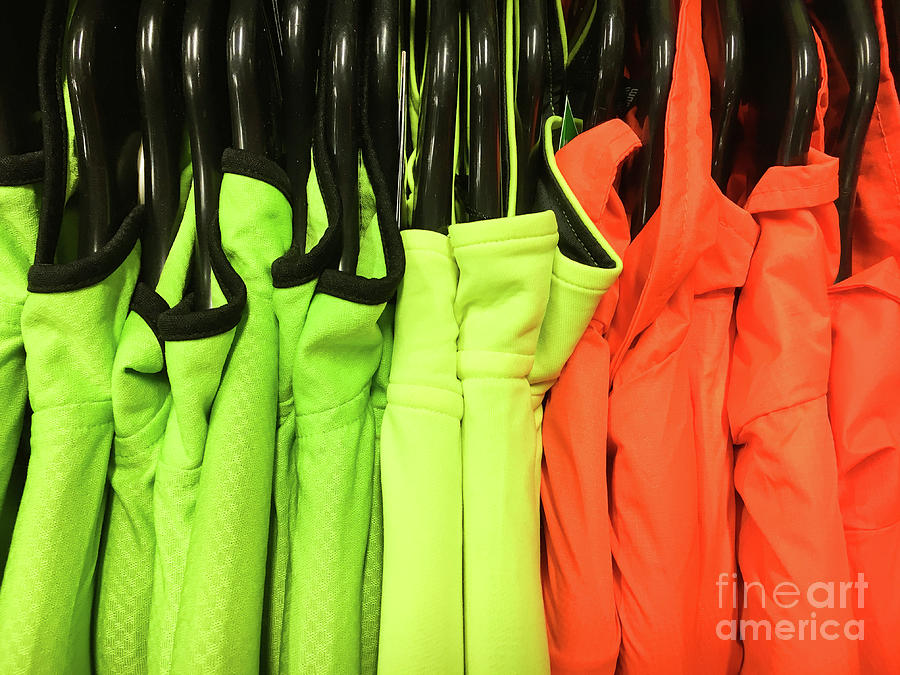 Colourful sports tops Photograph by Tom Gowanlock