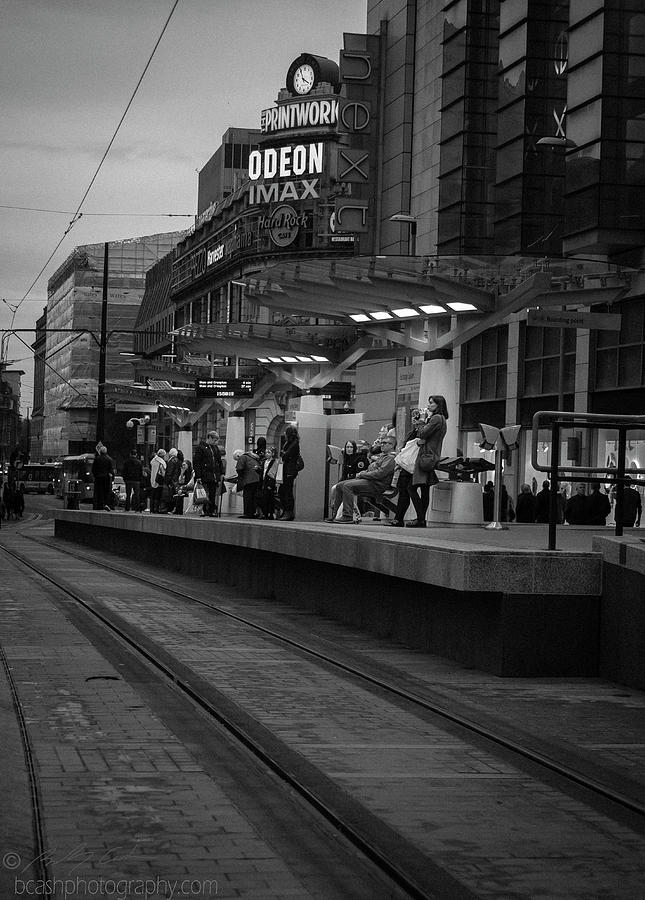 Commuters at tram station Photograph by B Cash