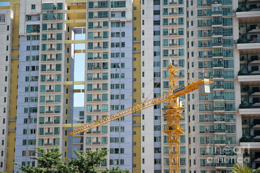 Apartment Building Front construction crane in front of the facade of a large apartment Apartment Building Front construction crane in front of the facade of a large apartment