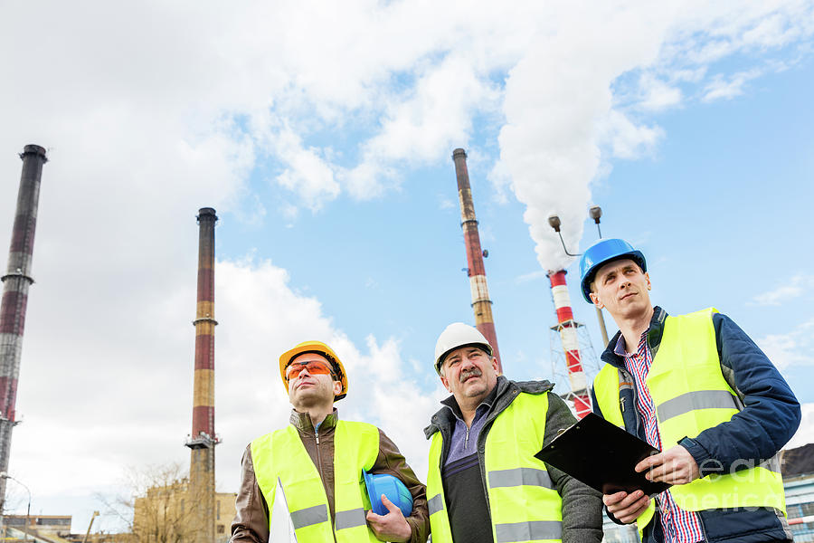 Construction engineers examining thermoelectric power station. Photograph by Michal Bednarek