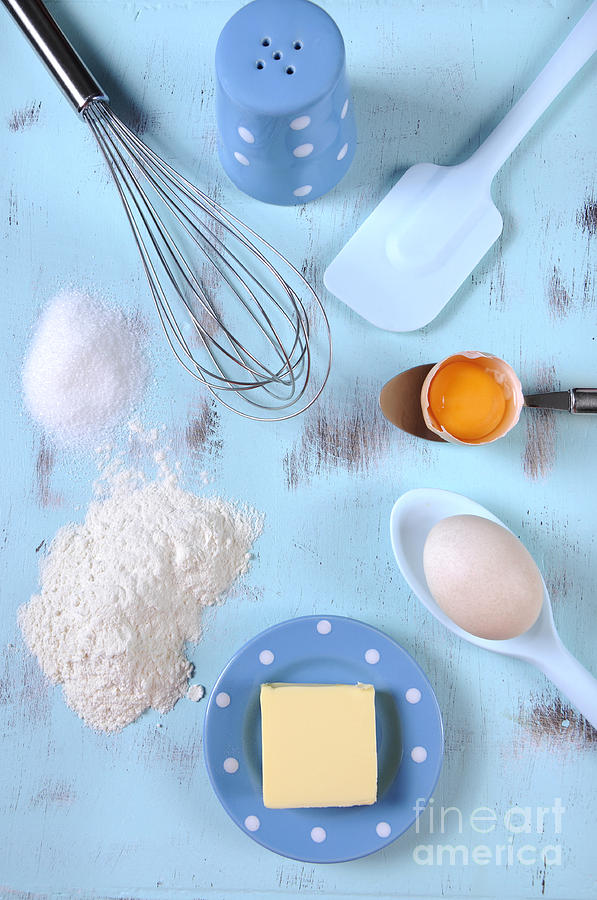Cooking and baking on vintage blue wood table.  Photograph by Milleflore Images