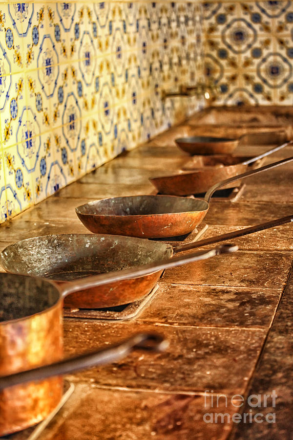 Copper pans in antique kitchen Photograph by Patricia Hofmeester