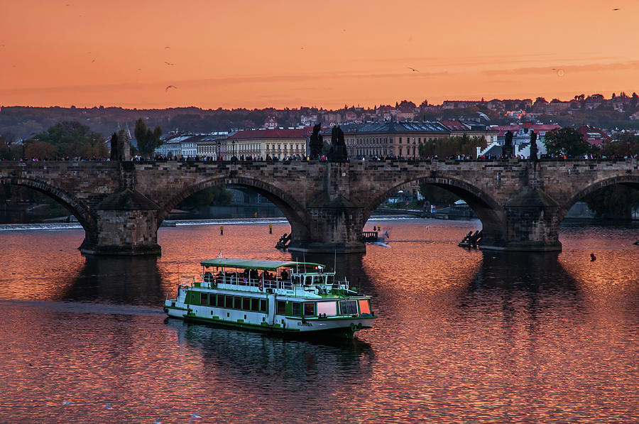 Copper Sunset over Vltava River. Prague Photograph by Jenny Rainbow