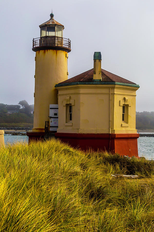 Coquille River Lighthouse And Dune Grass Photograph by Garry Gay