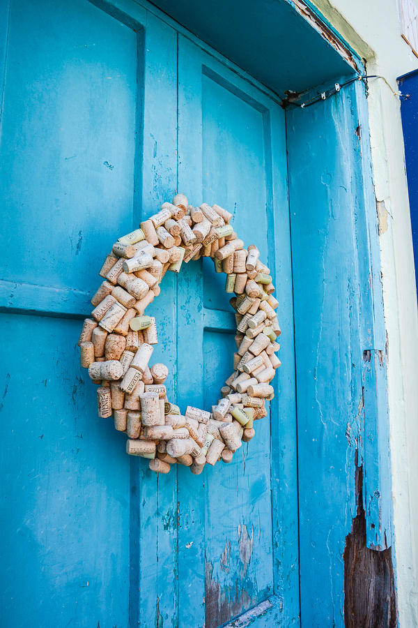Cork wreath on blue door in St George Bermuda Photograph by Nicole Freedman