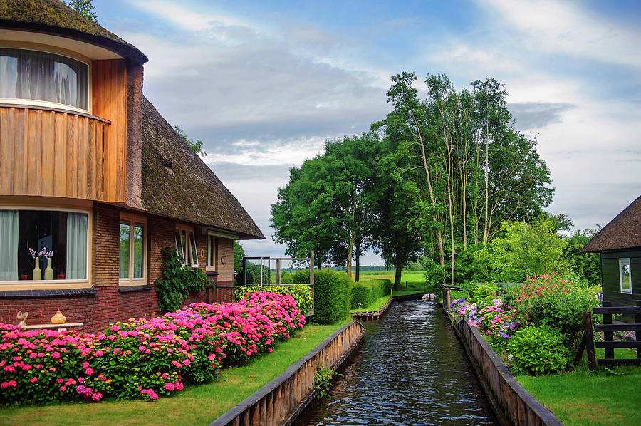 Cottage at Canal in Giethoorn. The Netherlands Photograph by Jenny Rainbow