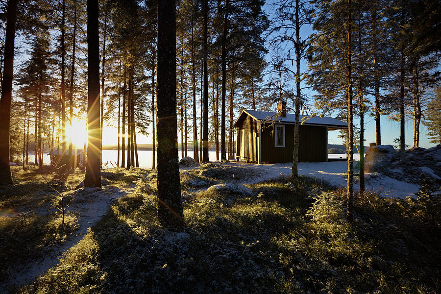 Cottage by the lake basking in the low winter sun Photograph by Ulrich Kunst And Bettina Scheidulin