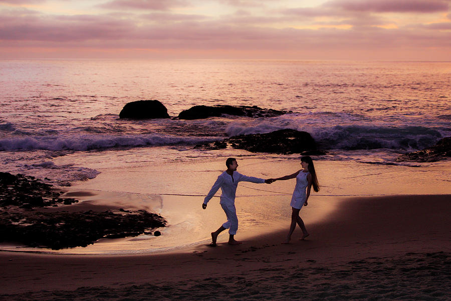 Couple at beach at Sunset Photograph by Garry Loss