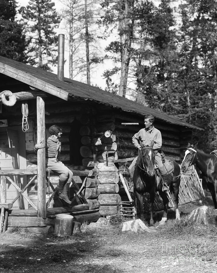 Couple At Log Cabin, C.1920-30s Photograph by H. Armstrong Roberts/ClassicStock