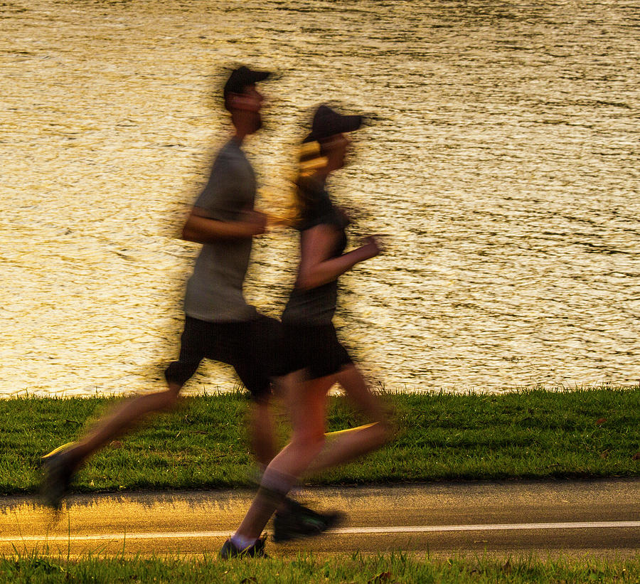 Couple Jogging in Forest Park Photograph by Garry McMichael