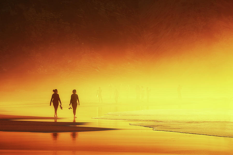 Couple Of Women Walking On Beach Photograph by Mikel Martinez de Osaba