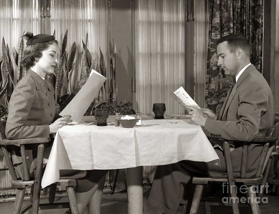 Couple Reading Menus, C.1950s Photograph by H. Armstrong Roberts/ClassicStock