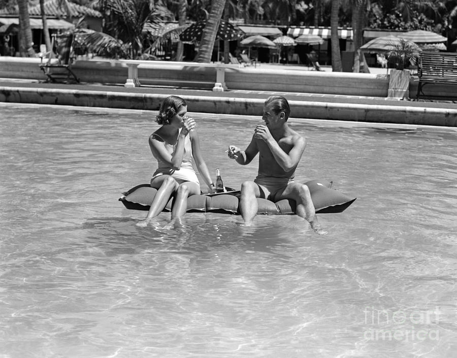 Couple Relaxing In Pool, C.1930-40s Photograph by H Armstrong Roberts and ClassicStock