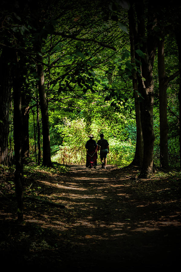 Couple Walking towards the Light through a Forest Path Tunnel Photograph by Randall Nyhof