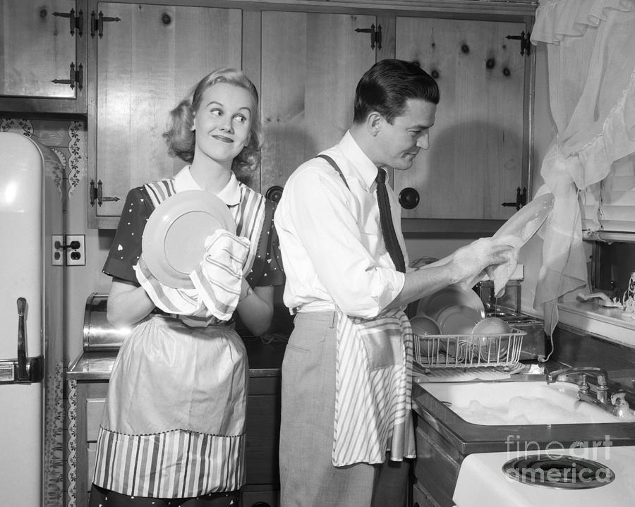 Vintage Photograph - Couple Washing Dishes And Smiling by Debrocke ClassicStock