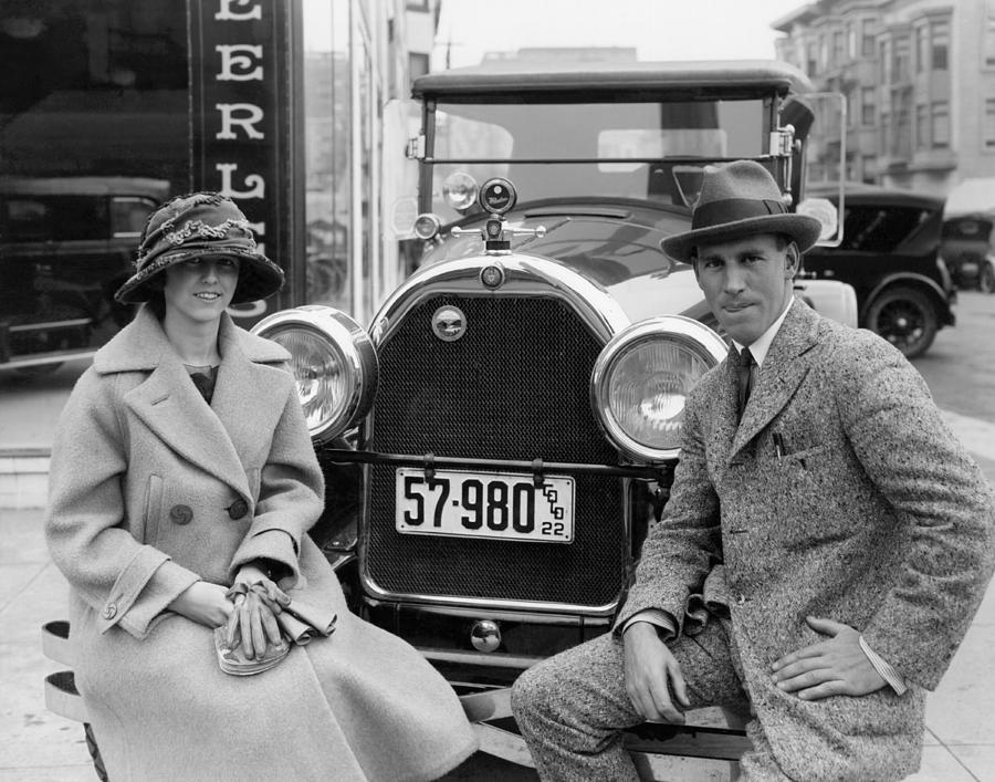 Couple With Their Peerless Car Photograph by Underwood Archives
