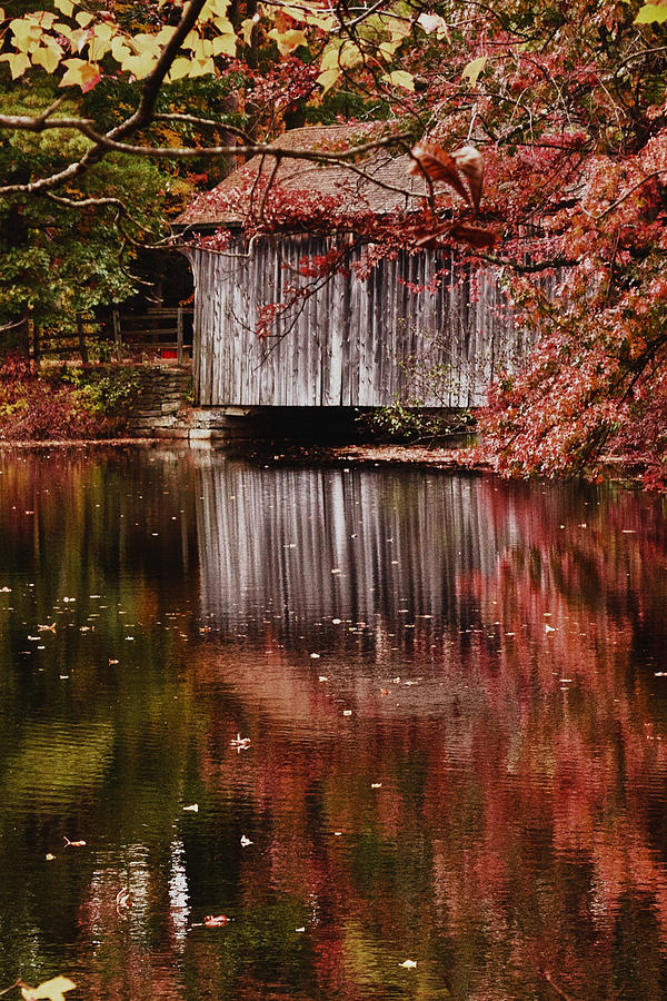 Covered bridge reflection Photograph by Jeff Folger