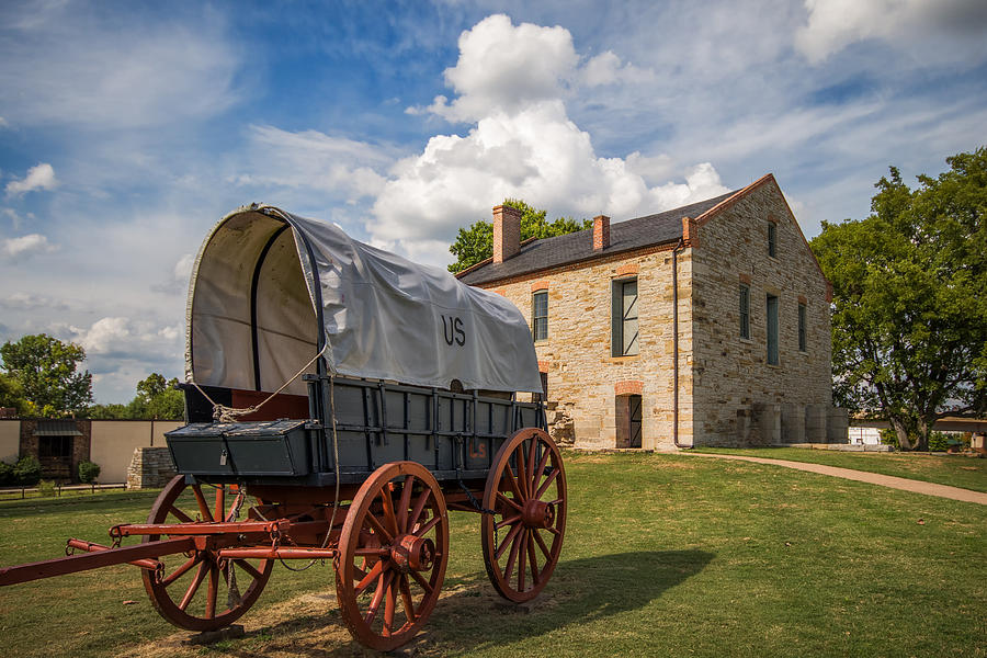 Covered Wagon and Stone Building Photograph by James Barber