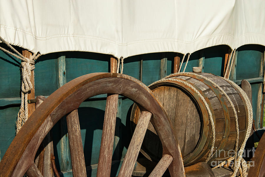Covered Wagon Wheel and Water Barrel Photograph by Bob Phillips