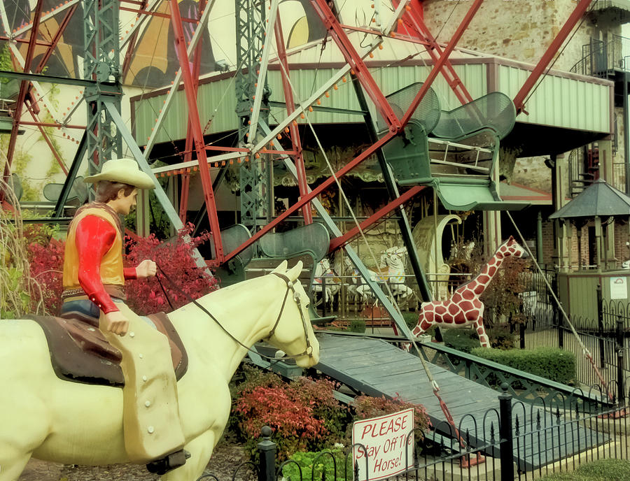 Cowboy And Giraffe Amusement Park Photograph by Tony Grider