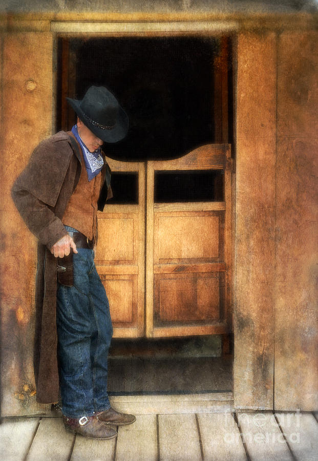 Cowboy by Saloon Doors Photograph by Jill Battaglia
