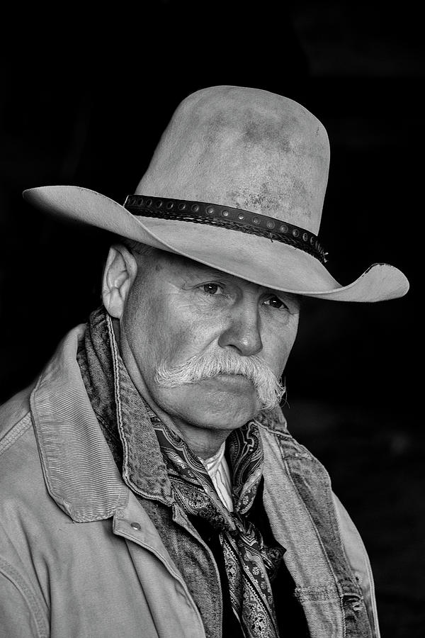 Cowboy in Barn 3 Portrait  Photograph by Sam Sherman