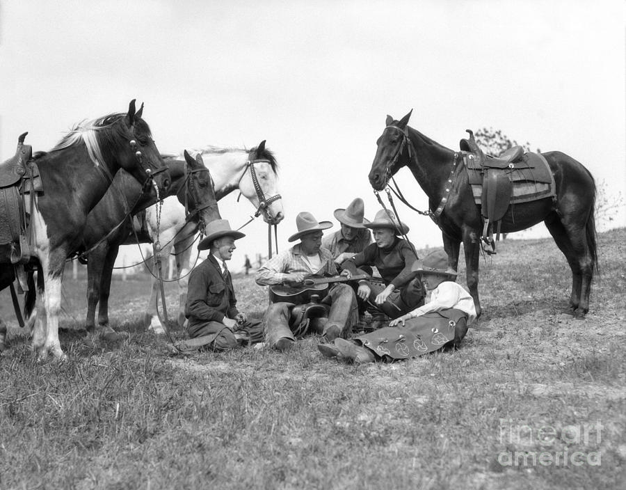 Cowboy Playing Guitar While Others Photograph by H. Armstrong Roberts/ClassicStock