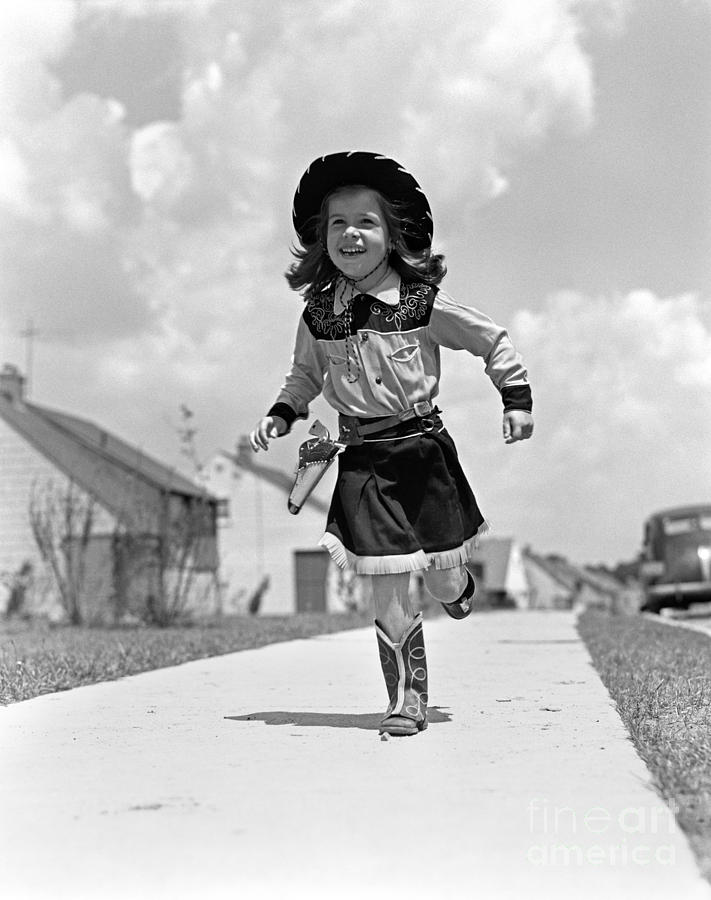 Cowgirl Running Down Sidewalk, C.1950s Photograph by H. Armstrong Roberts/ClassicStock