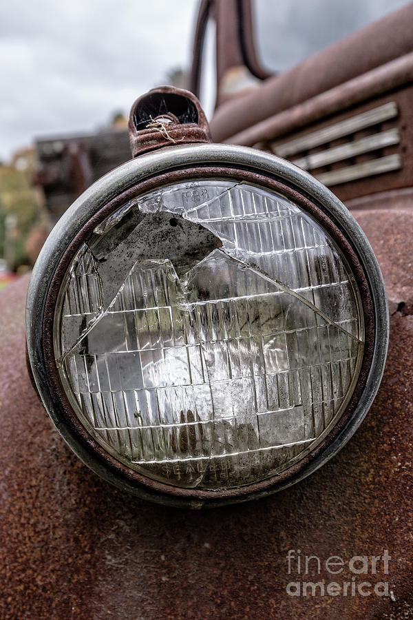Cracked Headlight on an old truck Photograph by Edward Fielding
