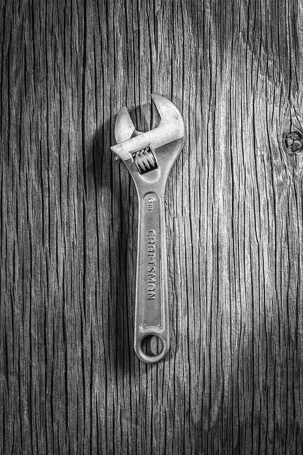 Craftsman Adjustable Wrench on Plywood 67 in BW Photograph by YoPedro
