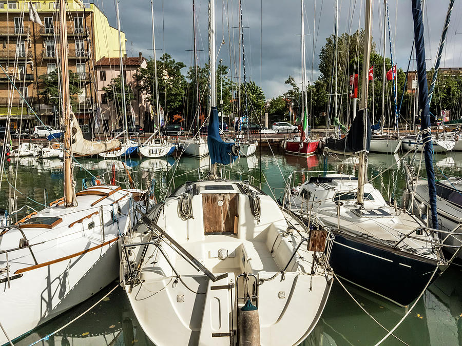 Cramped boathouse in Rimini Photograph by Marina Usmanskaya