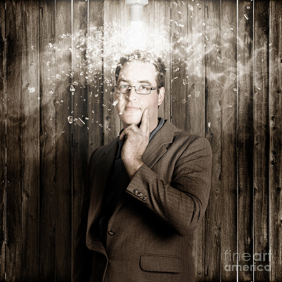Creative business man with bright light bulb idea Photograph by Jorgo Photography