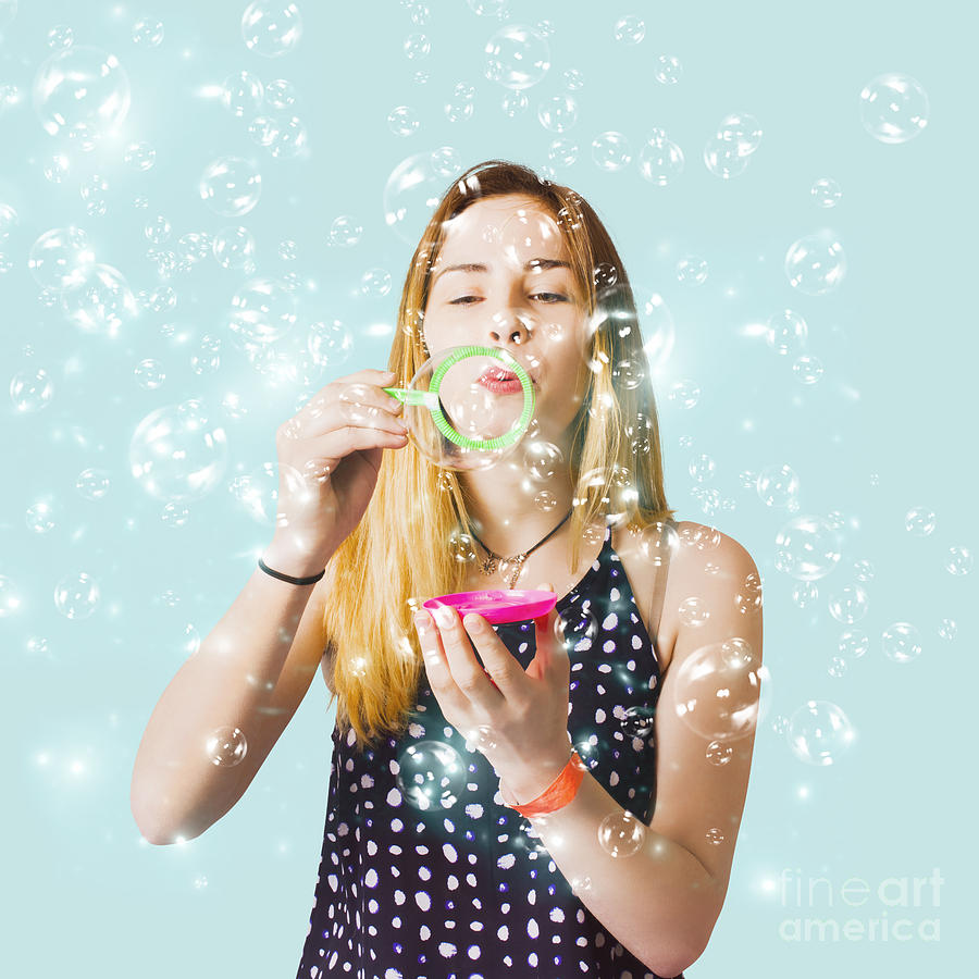 Creative woman blowing birthday party bubbles Photograph by Jorgo Photography