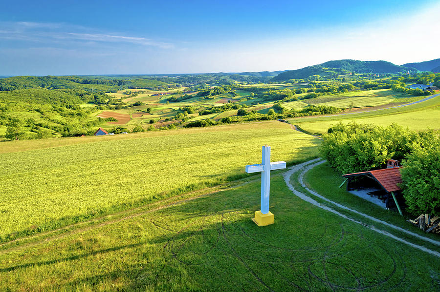 Cross on the hill in rural mountain village of Apatovec Photograph by Brch Photography