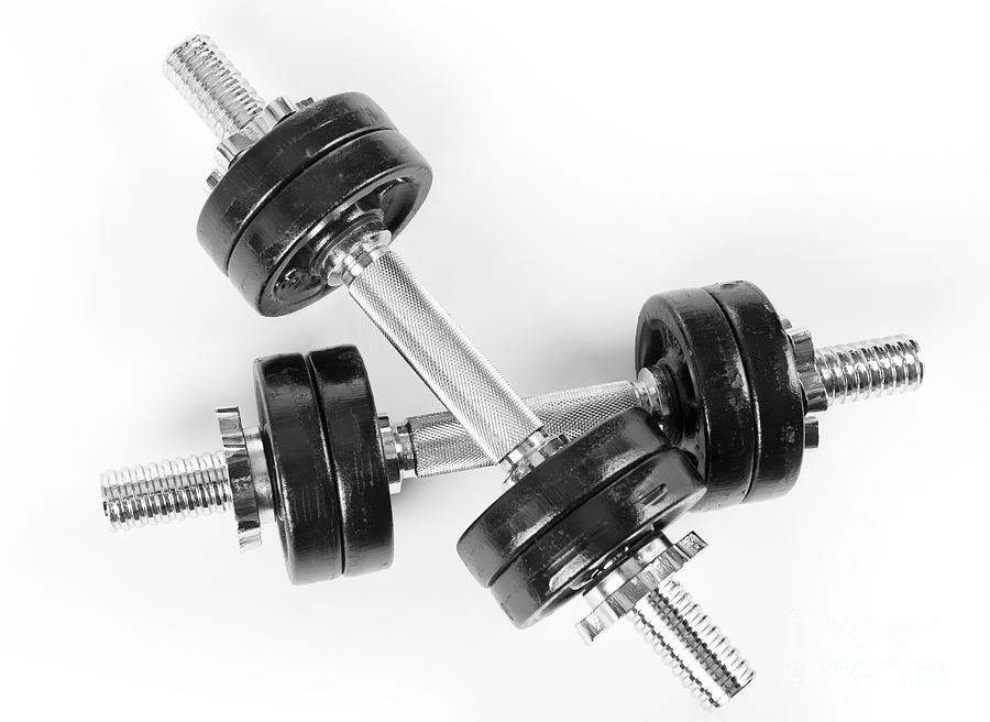 Crossed two hand barbells weights Photograph by Arletta Cwalina