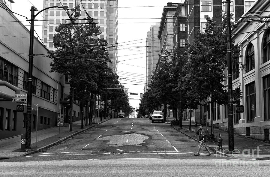 Crossing an Empty Street mono Photograph by John Rizzuto