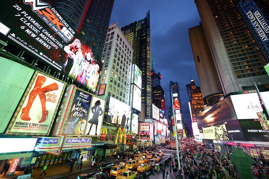 Crowded Times Square in the evening Photograph by Merijn Van der Vliet