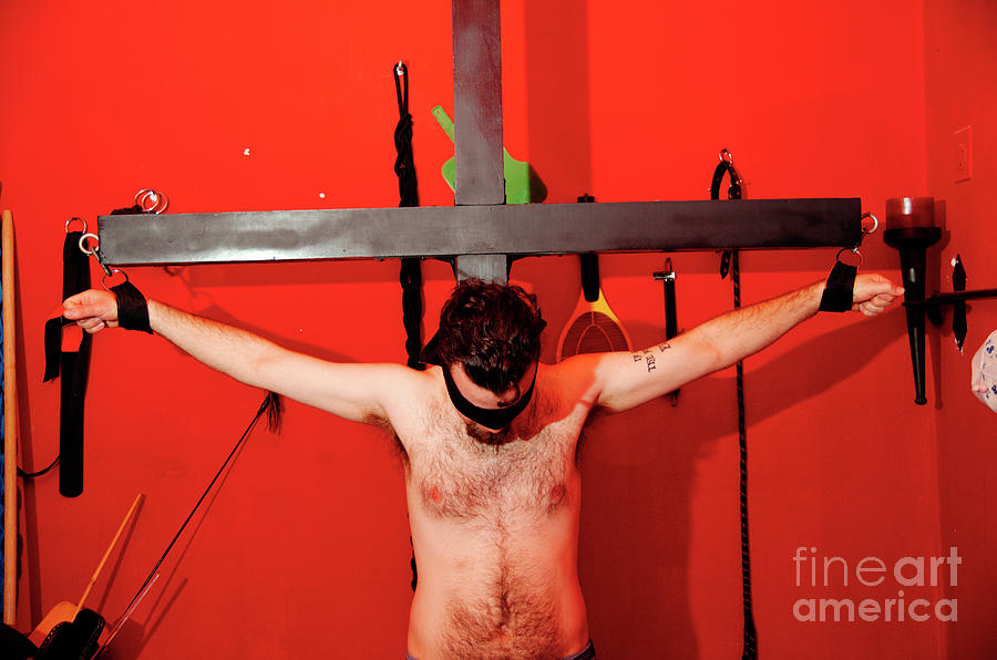 Tattoo Photograph - Crucified young man in a BDSM dungeon 5 by Ilan Rosen.