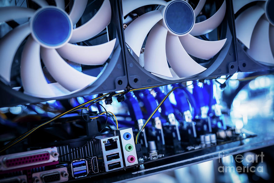 Cryptocurrency mining machine. Close-up Photograph by Michal Bednarek