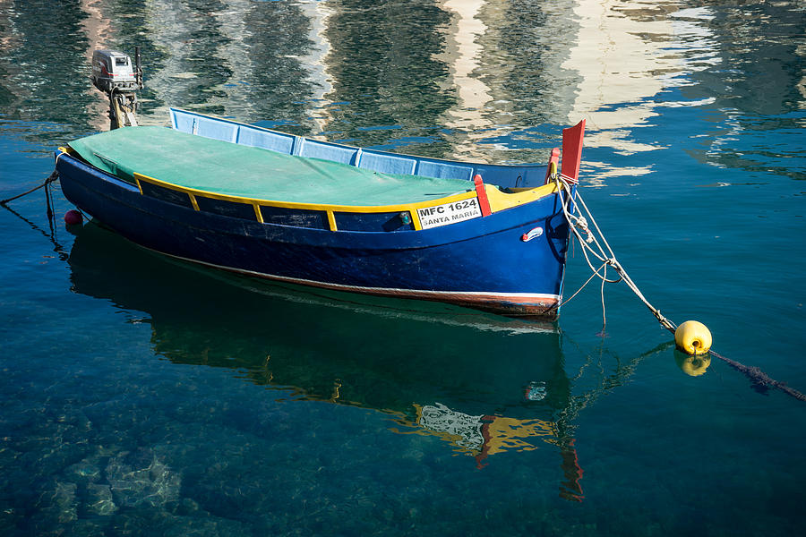 Crystal Clear Mediterranean Blue - Maltese Luzzu Fishing Boat at Anchor Photograph by Georgia Mizuleva