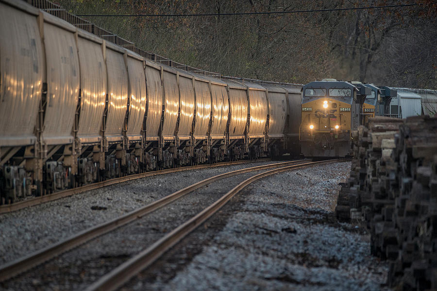 CSX Local J731-11, right, and loaded grain train G411-11 at Nortonville Ky Photograph by Jim Pearson