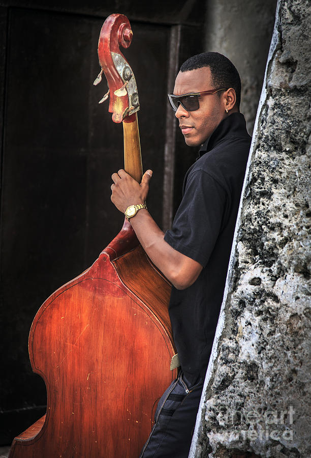 Cuban Bass Player Photograph by Craig J Satterlee