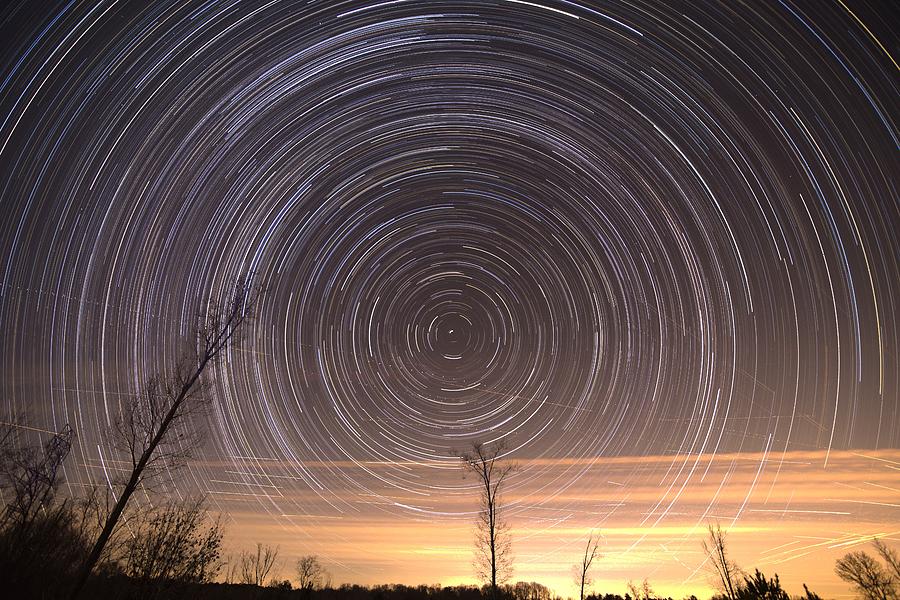 Cumulative time lapse of star trails in night sky Photograph by Alex Grichenko