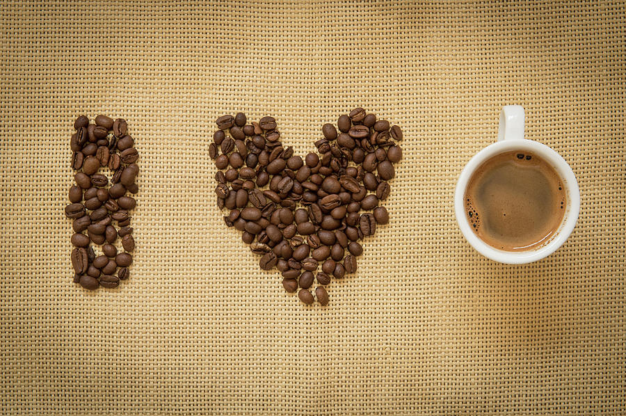 Cup of fresh espresso coffee  and beans Photograph by Michalakis Ppalis