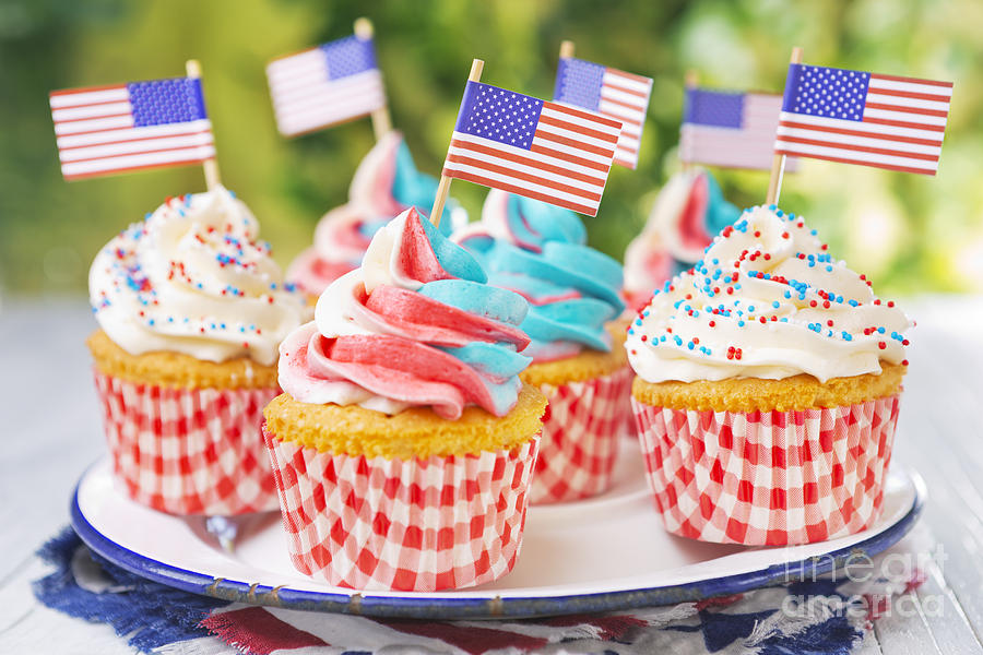 Independence Day Photograph - Cupcakes with red-white-and-blue frosting and American flags on  by Sara Winter