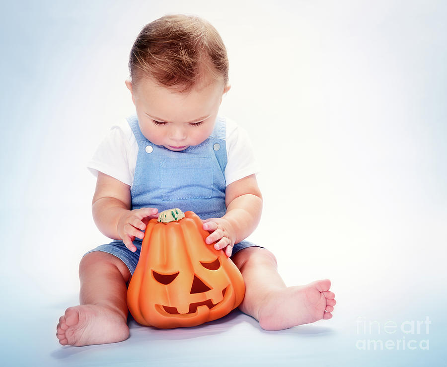 Cute baby boy with Halloween pumpkin Photograph by Anna Om